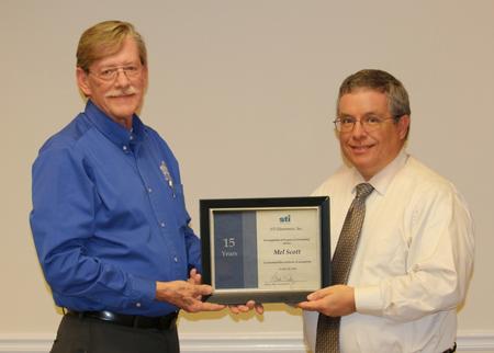 David Raby, President/CEO, presented Scott with a certificate in appreciation of his15 years of dedicated service.